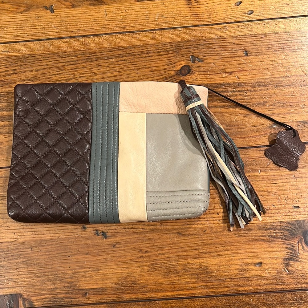 Beautiful leather clutch with tassels! Make an offer!